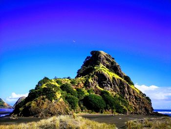 Low angle view of rock formations against sky