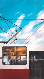 Train at railroad station against sky