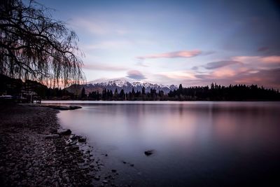 Scenic view of lake at sunset