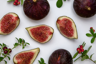 High angle view of figs with cherries on table