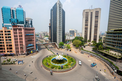 High angle view of city street and buildings against sky