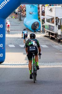 Man riding bicycle on road