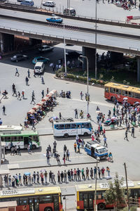 High angle view of people walking on road in city