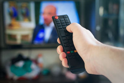 Close-up of hand holding camera