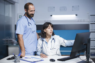 Female doctor working in office