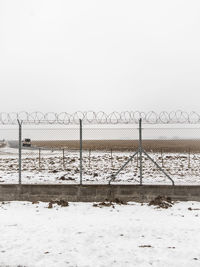 Scenic view of sea against clear sky during winter