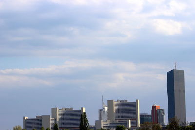 Modern buildings in city against sky