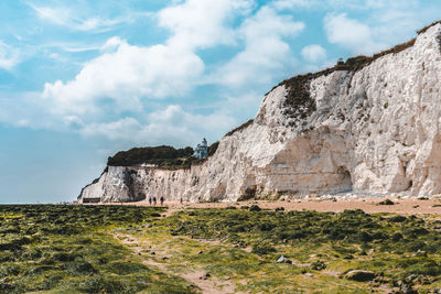 Rock formations on landscape against sky