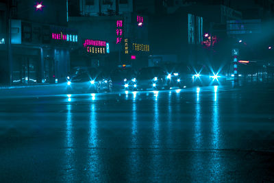 People on illuminated city at night