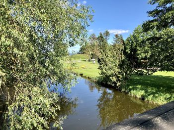 Scenic view of canal against sky