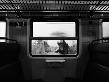 Wet window in train during rainy season