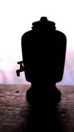 Close-up of silhouette figurine on table