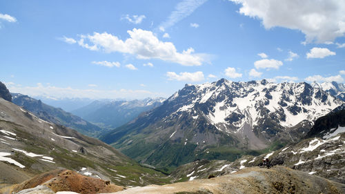 Scenic view of snowcapped mountains against sky