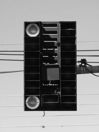 Low angle view of man on building wall