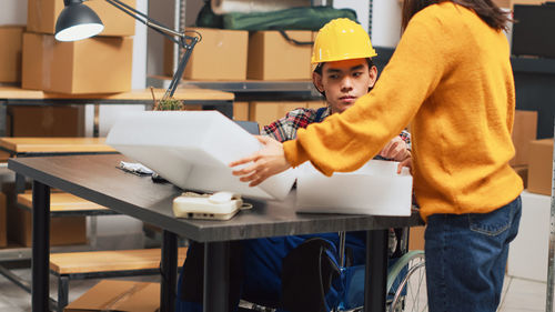 Midsection of man working in kitchen