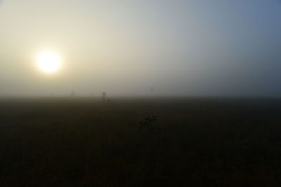 Scenic view of field against sky during sunset