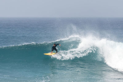 Man surfing in sea