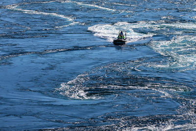 High angle view of ship sailing on sea