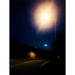 Illuminated street light at night