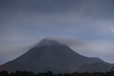 Scenic view of volcanic mountain against sky
