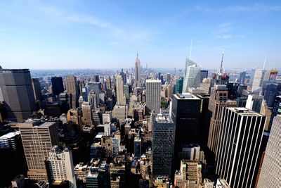 High angle view of cityscape against sky during sunny day