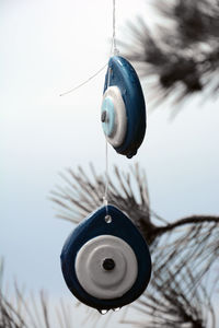 Close-up of fishing rod against clear sky