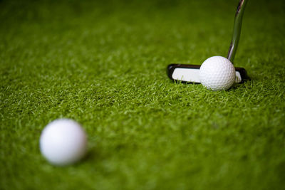 High angle view of golf ball on grass