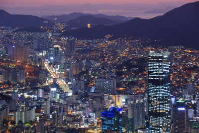 High angle view of illuminated city buildings at night