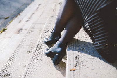 Close-up of man working on cable