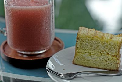 Close-up of bread and juice on table