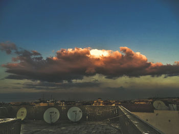Scenic view of bridge in city against sky