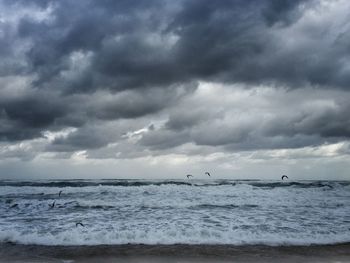 Scenic view of sea against cloudy sky