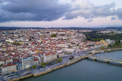 Coimbra city drone view with historic buildings at sunset, in portugal