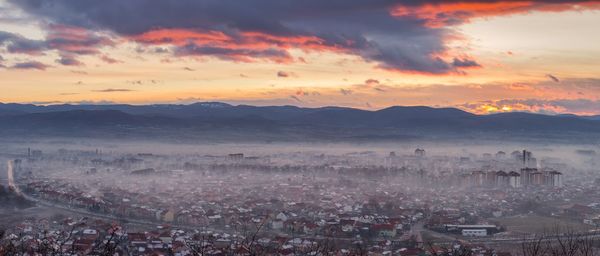 High angle shot of townscape against sky during sunset
