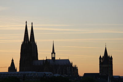 Historic building against sky during sunset