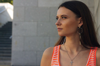 Portrait of a young woman looking away