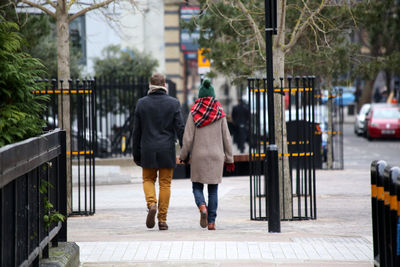 Rear view of woman standing in park