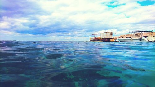 Scenic view of sea against cloudy sky