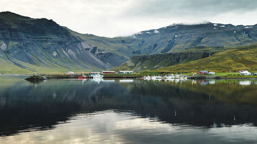 Scenic view of lake and mountains against sky