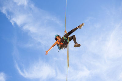 Young woman abseiling on chulilla canyon (spain)