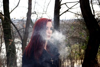 Portrait of young woman in forest