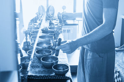 Midsection of man preparing food on table