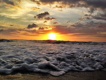 Scenic view of sea at sunset