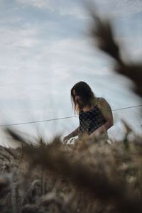 Close-up of woman against sky