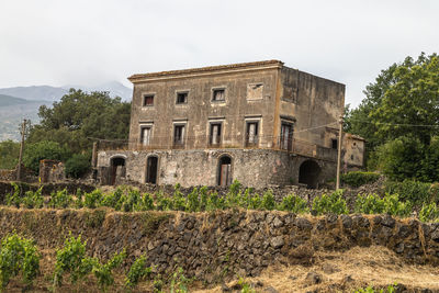 Low angle view of old building against sky