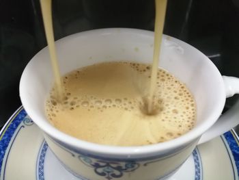 High angle view of coffee cup on table