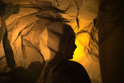 Shadow of person on paper at night