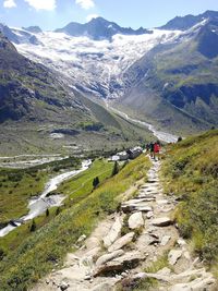 Scenic view of stream amidst mountains