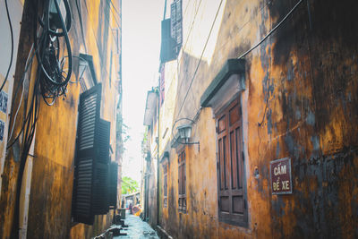 Narrow street amidst buildings