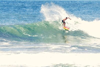 Full length of man surfing in sea